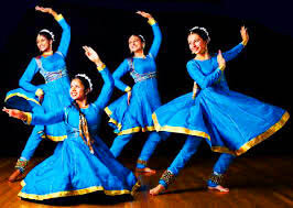 Professional Kathak dancer in traditional North Indian costume with graceful pose